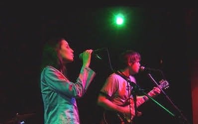 Emma performing onstage with The Melody Unit